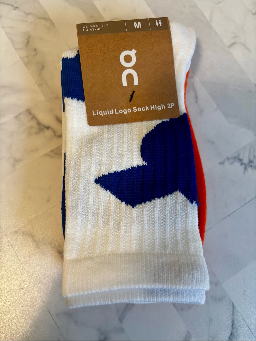 On Running White Crew Socks with Blue and Orange Accents - Liquid Logo High 2P